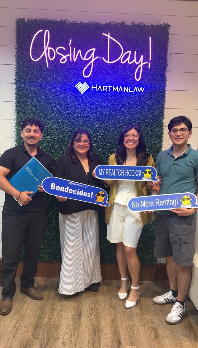 Justin Trevilla celebrating closing day with new homeowners and their family